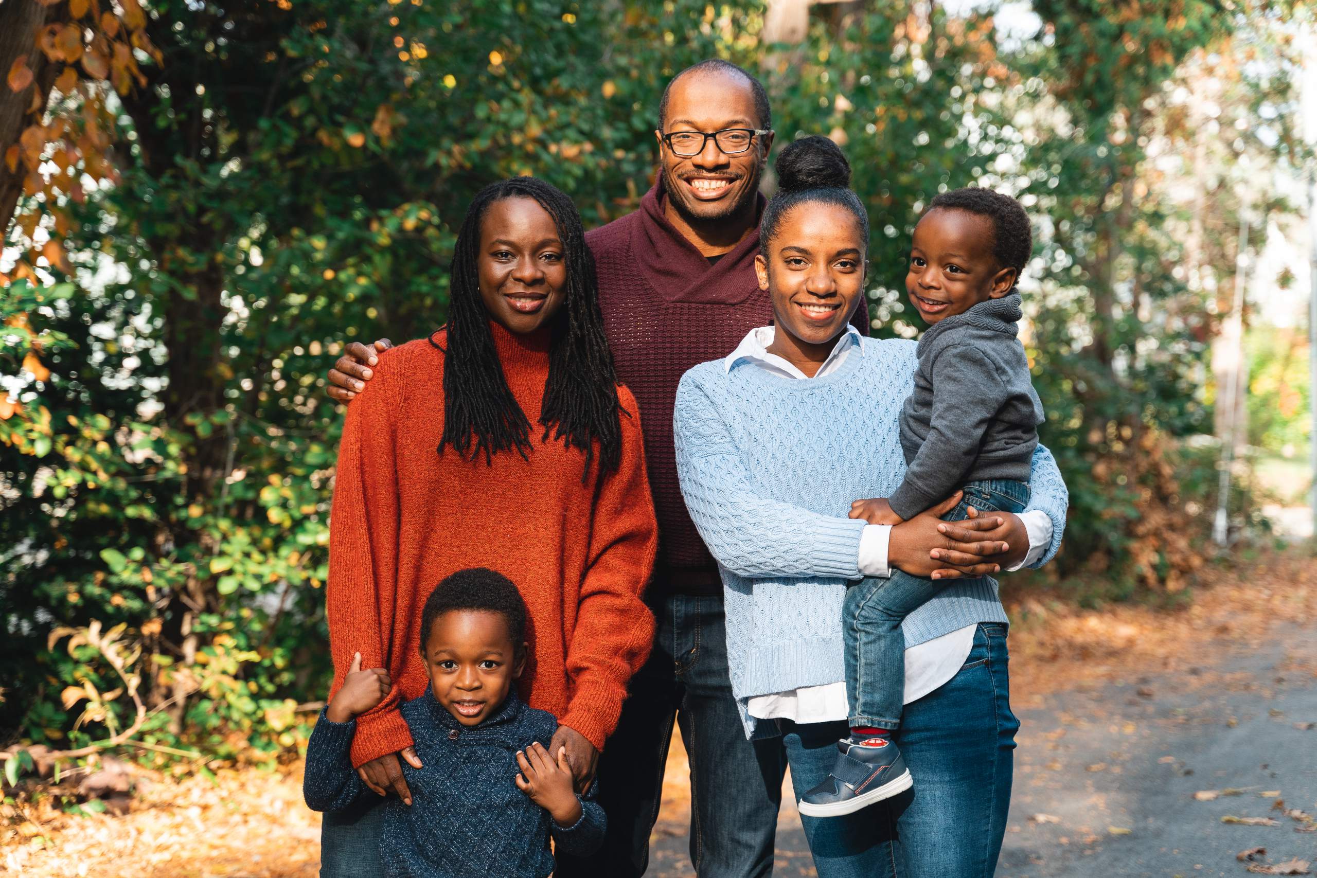 african american family poses with their young children